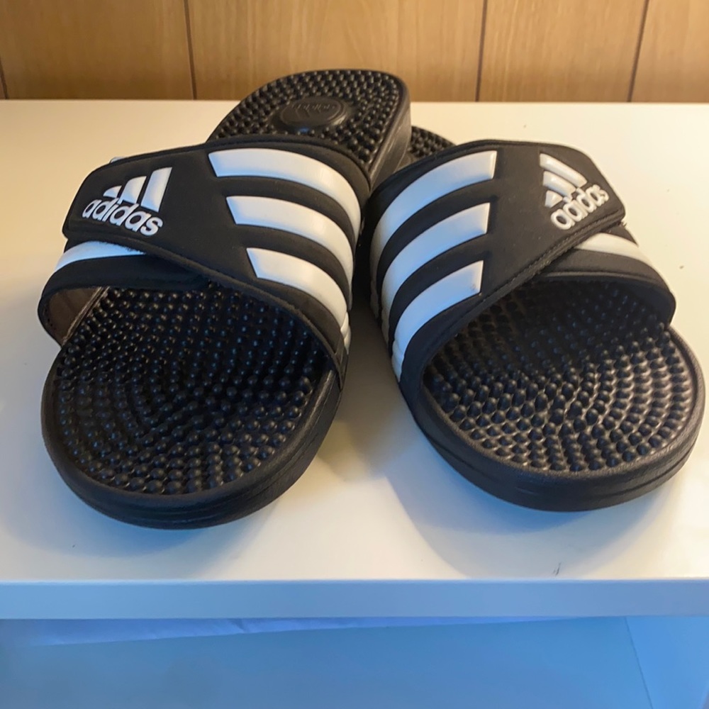 Adidas three stripe slides. Slightly worn.